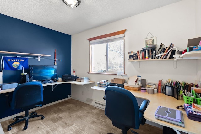 1509 Eagle Dr, Kalispell, MT 59901 - office with a baseboard heating unit, wood finished floors, and a textured ceiling
