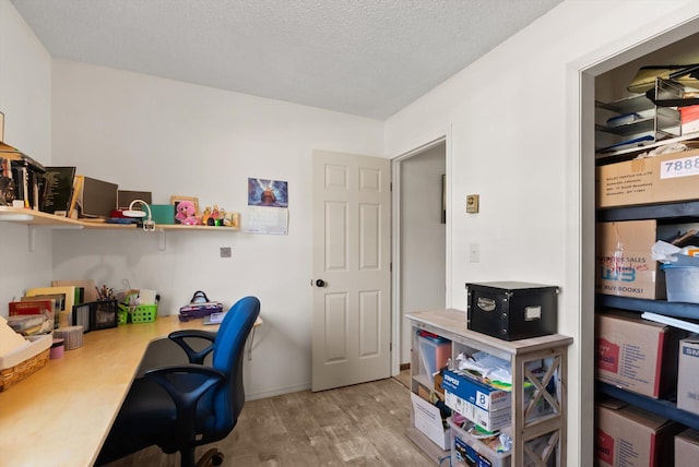 1509 Eagle Dr, Kalispell, MT 59901 - office with wood finished floors, a textured ceiling, and baseboards