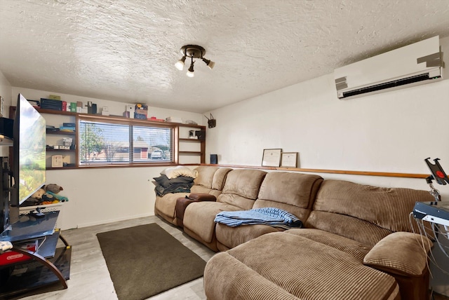 1509 Eagle Dr, Kalispell, MT 59901 - living area featuring a wall unit AC, wood finished floors, and a textured ceiling