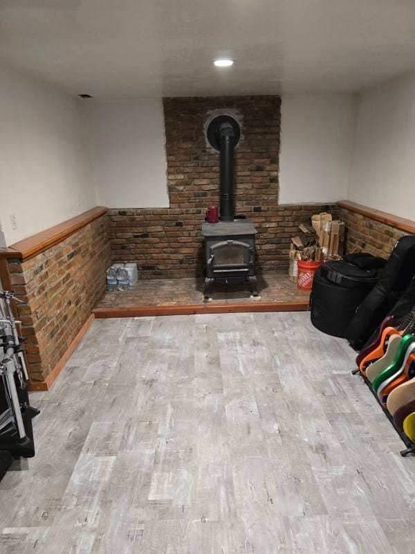 1509 Eagle Dr, Kalispell, MT 59901 - living room featuring a wood stove and wood finished floors