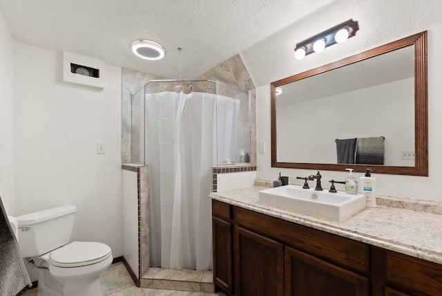 1509 Eagle Dr, Kalispell, MT 59901 - full bath featuring vanity, toilet, a shower stall, and a textured ceiling