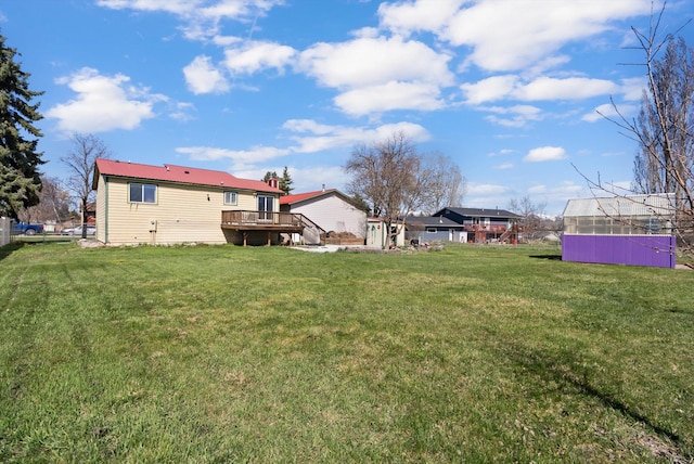 1509 Eagle Dr, Kalispell, MT 59901 - view of grassy yard featuring a deck
