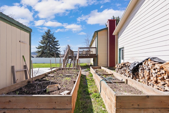 1509 Eagle Dr, Kalispell, MT 59901 - view of yard with a garden, a deck, and stairs
