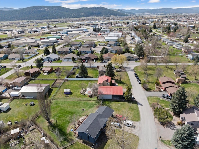 1509 Eagle Dr, Kalispell, MT 59901 - aerial view of property and surrounding area featuring a mountainous background and nearby suburban area