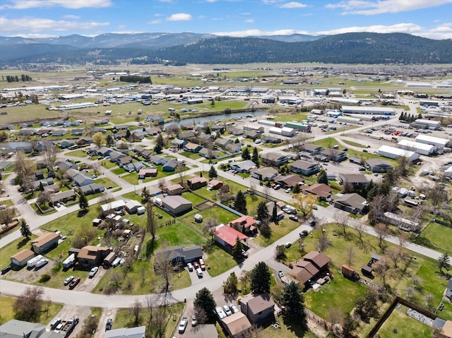1509 Eagle Dr, Kalispell, MT 59901 - aerial overview of property's location with mountains and nearby suburban area