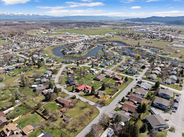 1509 Eagle Dr, Kalispell, MT 59901 - aerial overview of property's location with a water and mountain view and nearby suburban area
