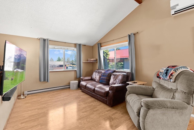1509 Eagle Dr, Kalispell, MT 59901 - living room with a baseboard radiator, an AC wall unit, light wood finished floors, vaulted ceiling, and a textured ceiling