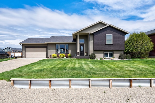 1150 Vega Rd, Helena, MT 59602 - tri-level home with an attached garage, a front yard, and driveway