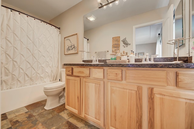 1150 Vega Rd, Helena, MT 59602 - full bath featuring double vanity, toilet, stone tile flooring, and shower / tub combo with curtain