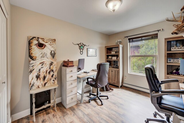1150 Vega Rd, Helena, MT 59602 - office area featuring light wood-style floors, baseboards, and baseboard heating
