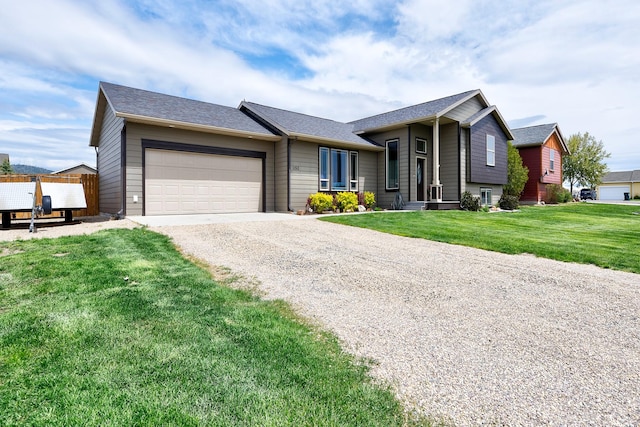 1150 Vega Rd, Helena, MT 59602 - view of front facade with driveway, an attached garage, and a front yard