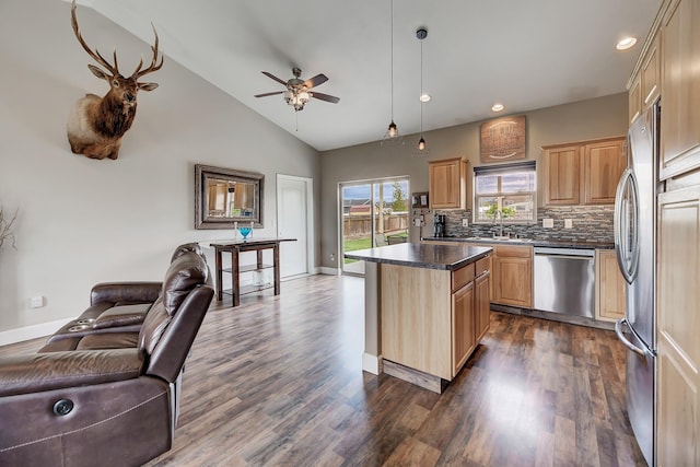 1150 Vega Rd, Helena, MT 59602 - kitchen featuring appliances with stainless steel finishes, open floor plan, dark countertops, light brown cabinets, and recessed lighting