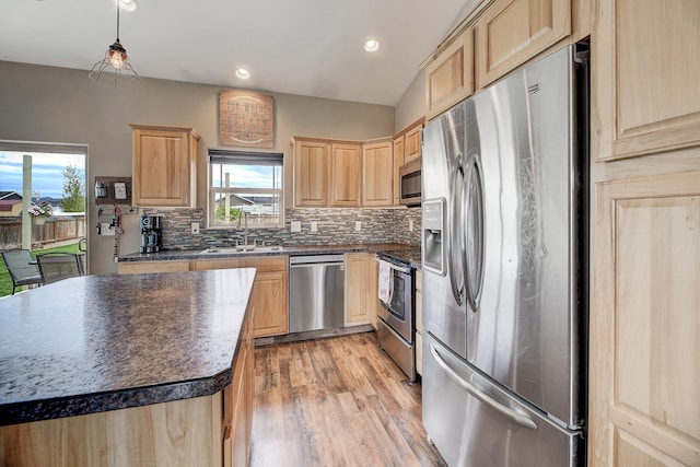 1150 Vega Rd, Helena, MT 59602 - kitchen with stainless steel appliances, light brown cabinetry, a sink, dark countertops, and recessed lighting
