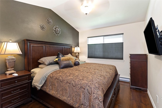 1 Kootenai Ave Unit 17, Polson, MT 59860 - bedroom featuring vaulted ceiling, dark wood finished floors, a baseboard heating unit, baseboards, and ceiling fan