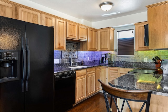 1 Kootenai Ave Unit 17, Polson, MT 59860 - kitchen featuring black appliances, a sink, dark stone counters, and backsplash