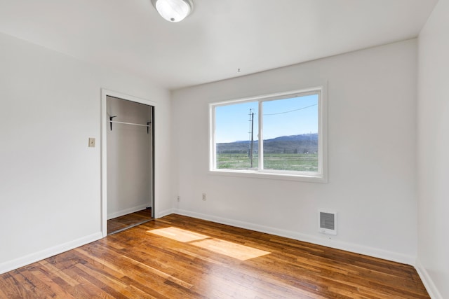 1680 W River Rd, Deer Lodge, MT 59722 - unfurnished bedroom with wood finished floors and a closet