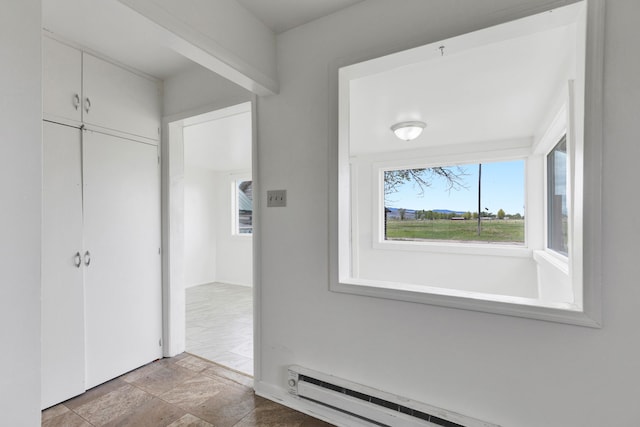 1680 W River Rd, Deer Lodge, MT 59722 - hall with a baseboard radiator and stone finish floors
