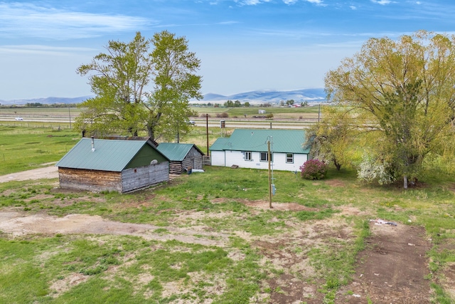 1680 W River Rd, Deer Lodge, MT 59722 - view of yard with a pole building, a view of countryside, an outbuilding, and a mountain view