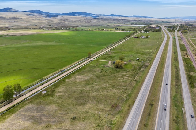 1680 W River Rd, Deer Lodge, MT 59722 - aerial overview of property's location featuring a mountain backdrop and rural landscape