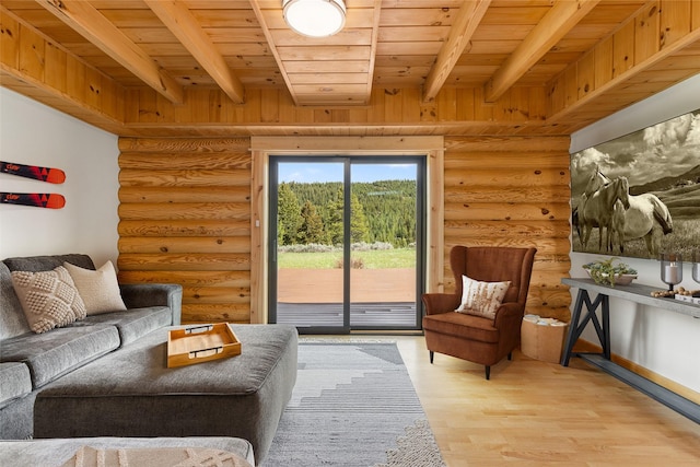 1266 Ousel Falls Rd, Big Sky, MT 59716 - living area featuring rustic walls, wood ceiling with exposed beams, and light wood finished floors