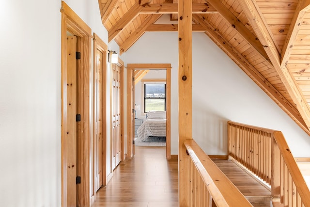 1266 Ousel Falls Rd, Big Sky, MT 59716 - hall with wood ceiling, wood finished floors, and an upstairs landing