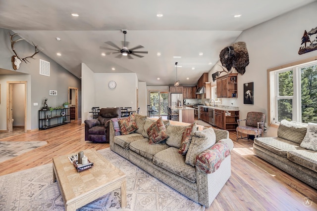 115 Grassy Mountain Rd, White Sulphur Springs, MT 59645 - living room with healthy amount of natural light, light wood-style floors, ceiling fan, recessed lighting, and high vaulted ceiling