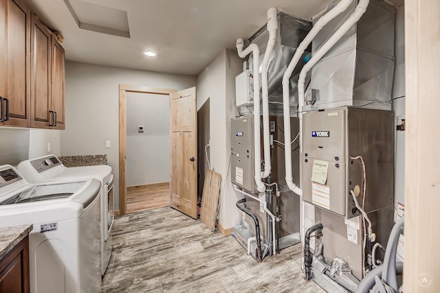 115 Grassy Mountain Rd, White Sulphur Springs, MT 59645 - laundry area featuring independent washer and dryer, cabinet space, attic access, light wood-style floors, and recessed lighting