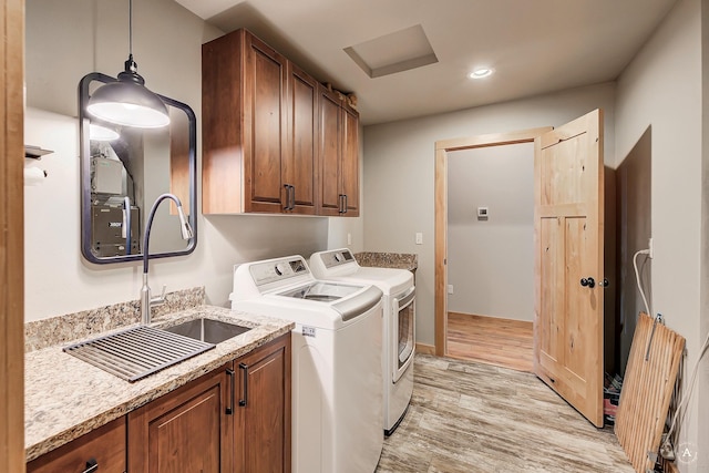 115 Grassy Mountain Rd, White Sulphur Springs, MT 59645 - laundry room featuring washer and clothes dryer, cabinet space, light wood-style flooring, and recessed lighting