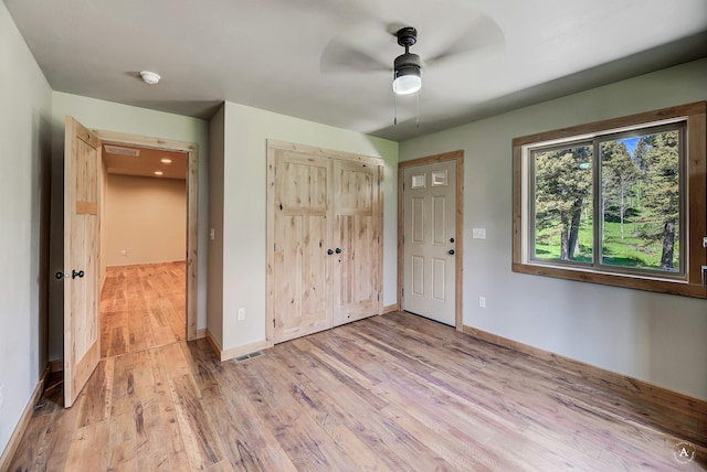115 Grassy Mountain Rd, White Sulphur Springs, MT 59645 - foyer entrance with ceiling fan, light wood finished floors, and baseboards