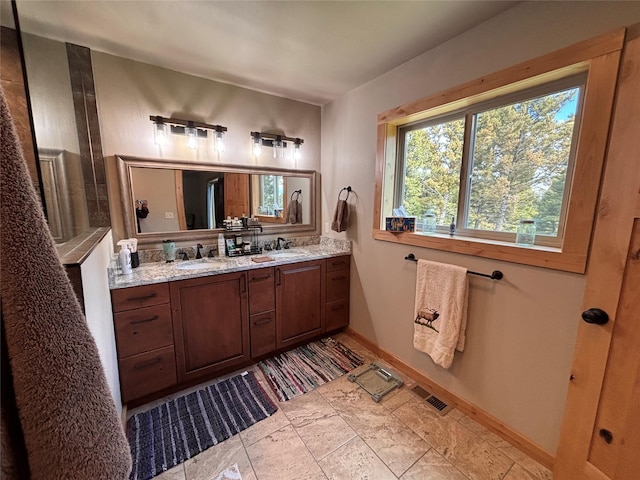 115 Grassy Mountain Rd, White Sulphur Springs, MT 59645 - full bath featuring double vanity and baseboards