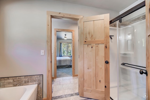 115 Grassy Mountain Rd, White Sulphur Springs, MT 59645 - ensuite bathroom featuring a stall shower, a bath, and stone tile floors