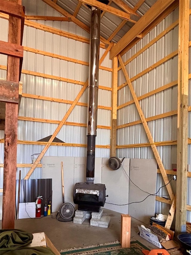 115 Grassy Mountain Rd, White Sulphur Springs, MT 59645 - garage featuring a wood stove and metal wall