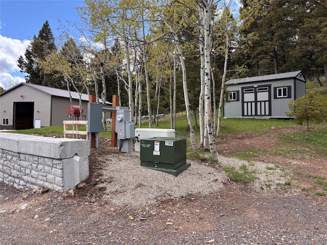 115 Grassy Mountain Rd, White Sulphur Springs, MT 59645 - view of yard featuring an outdoor structure and a garage