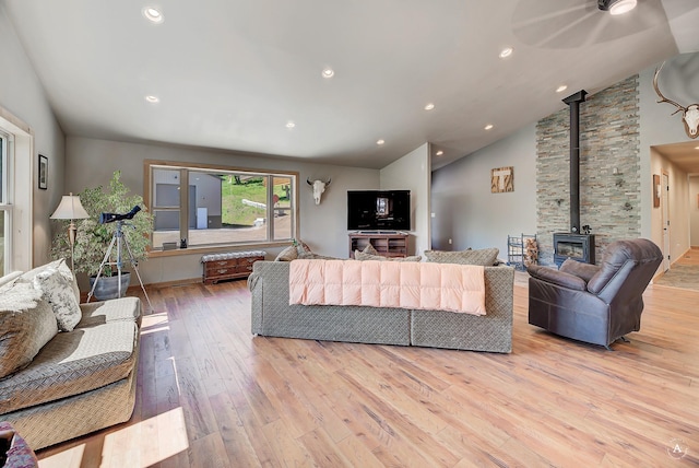 115 Grassy Mountain Rd, White Sulphur Springs, MT 59645 - living area with lofted ceiling, light wood finished floors, and a wood stove
