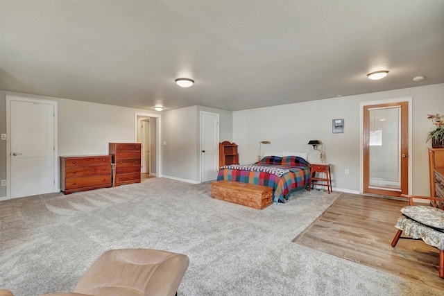 510 Mission St, Stevensville, MT 59870 - carpeted bedroom with baseboards and wood finished floors