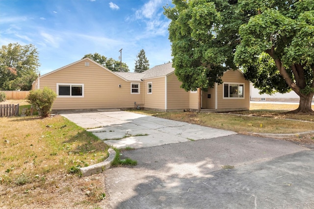 510 Mission St, Stevensville, MT 59870 - rear view of property featuring driveway and a lawn