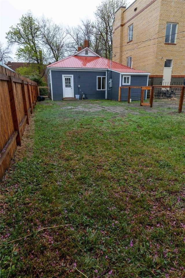 210 S Maryland St, Conrad, MT 59425 - back of property featuring metal roof and a chimney