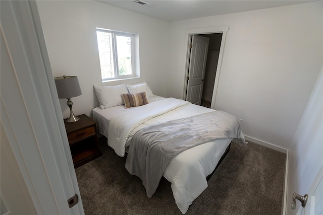 412 Bear Canyon Rd, Lakeside, MT 59922 - bedroom featuring dark carpet and baseboards