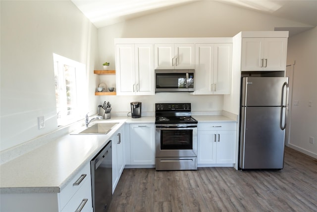 412 Bear Canyon Rd, Lakeside, MT 59922 - kitchen featuring stainless steel appliances, vaulted ceiling, open shelves, a sink, and white cabinets