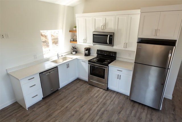 412 Bear Canyon Rd, Lakeside, MT 59922 - kitchen featuring stainless steel appliances, a sink, white cabinets, and dark wood finished floors