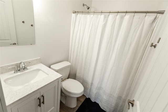 412 Bear Canyon Rd, Lakeside, MT 59922 - bathroom featuring vanity, toilet, and a shower with shower curtain