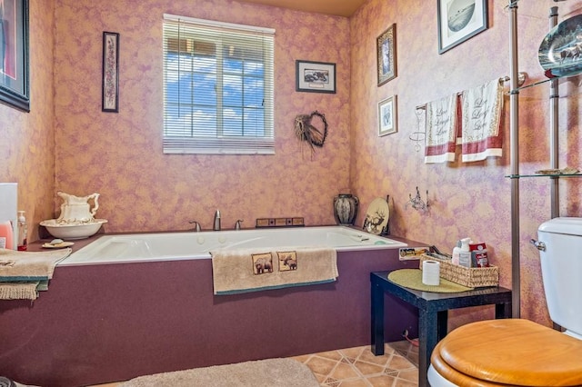 16 Grassland Way, Roundup, MT 59072 - full bath featuring toilet, a tub to relax in, and tile patterned floors