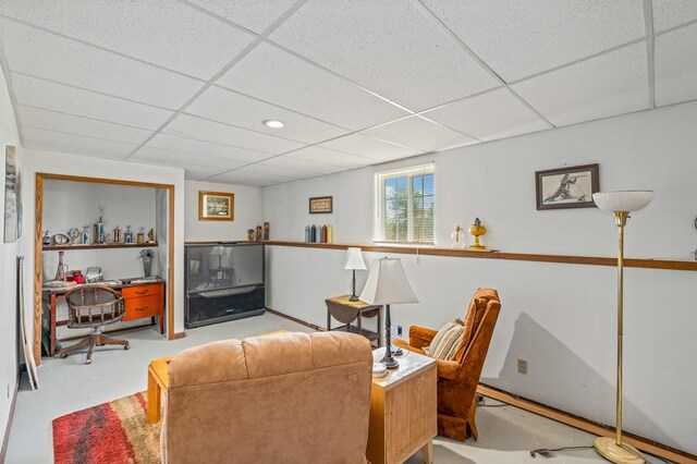 16 Grassland Way, Roundup, MT 59072 - living room featuring a drop ceiling and finished concrete flooring