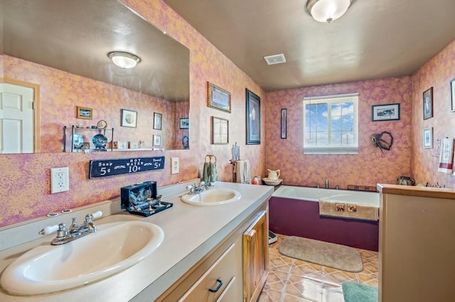 16 Grassland Way, Roundup, MT 59072 - bathroom featuring a bath, double vanity, and tile patterned floors