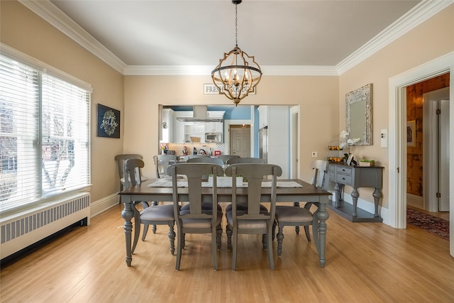 442 4th Ave E, Kalispell, MT 59901 - dining space featuring crown molding, a chandelier, and light wood finished floors