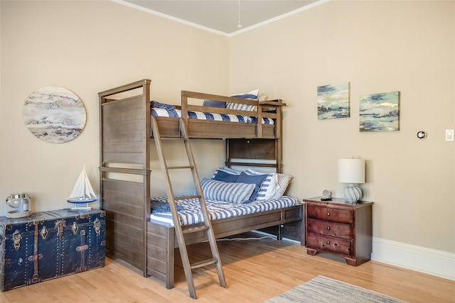 442 4th Ave E, Kalispell, MT 59901 - bedroom featuring radiator heating unit, light wood-style flooring, crown molding, and ceiling fan