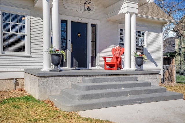 442 4th Ave E, Kalispell, MT 59901 - view of front of house featuring a garage, driveway, and a chimney