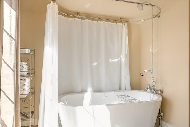 442 4th Ave E, Kalispell, MT 59901 - full bathroom featuring french doors, a chandelier, vaulted ceiling, wood finished floors, and plenty of natural light