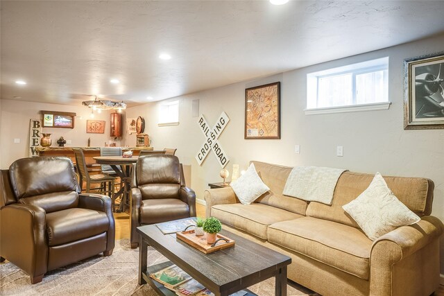 442 4th Ave E, Kalispell, MT 59901 - hall featuring a barn door, recessed lighting, concrete flooring, wooden walls, and baseboards