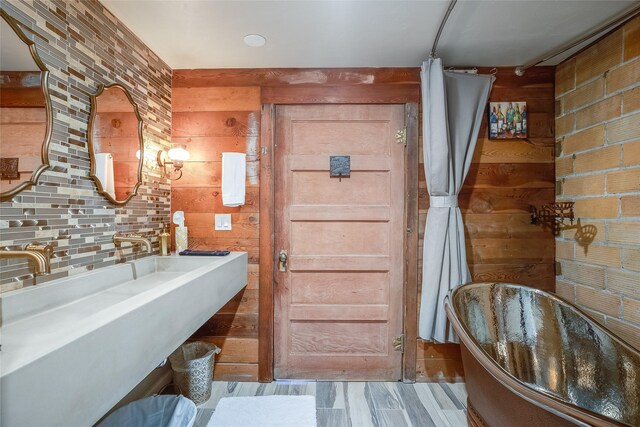 442 4th Ave E, Kalispell, MT 59901 - bathroom with a sink and decorative backsplash
